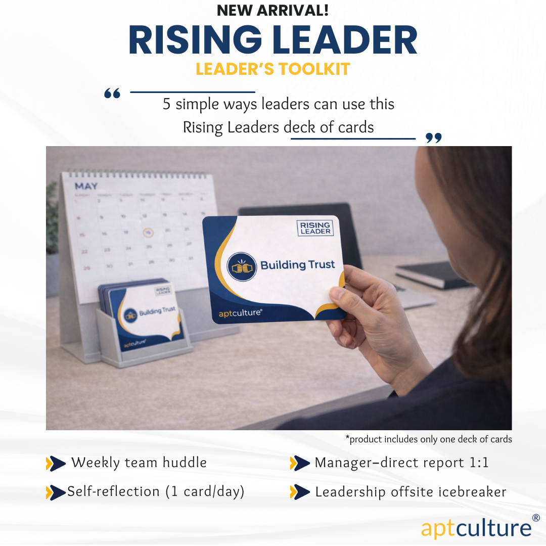 Leadership toolkit cards on a desk beside a notebook.